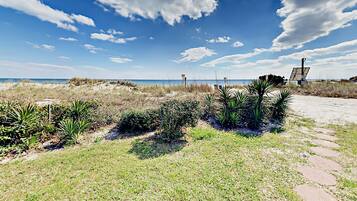 Stroll along the winding pathway to a serene body of water.