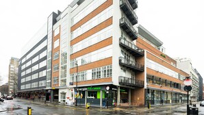 A multi-story building with a ground-floor fitness center and a restaurant. - Charming Old Street 1BR, 5 min walk to Old Street Tube, by Blueground (London)