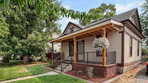 A two-story house with a covered porch, a front door, and a mailbox. - 💎Urban Glam Gem💎 Rancher near Gonzaga w/GiG Internet (Spokane)