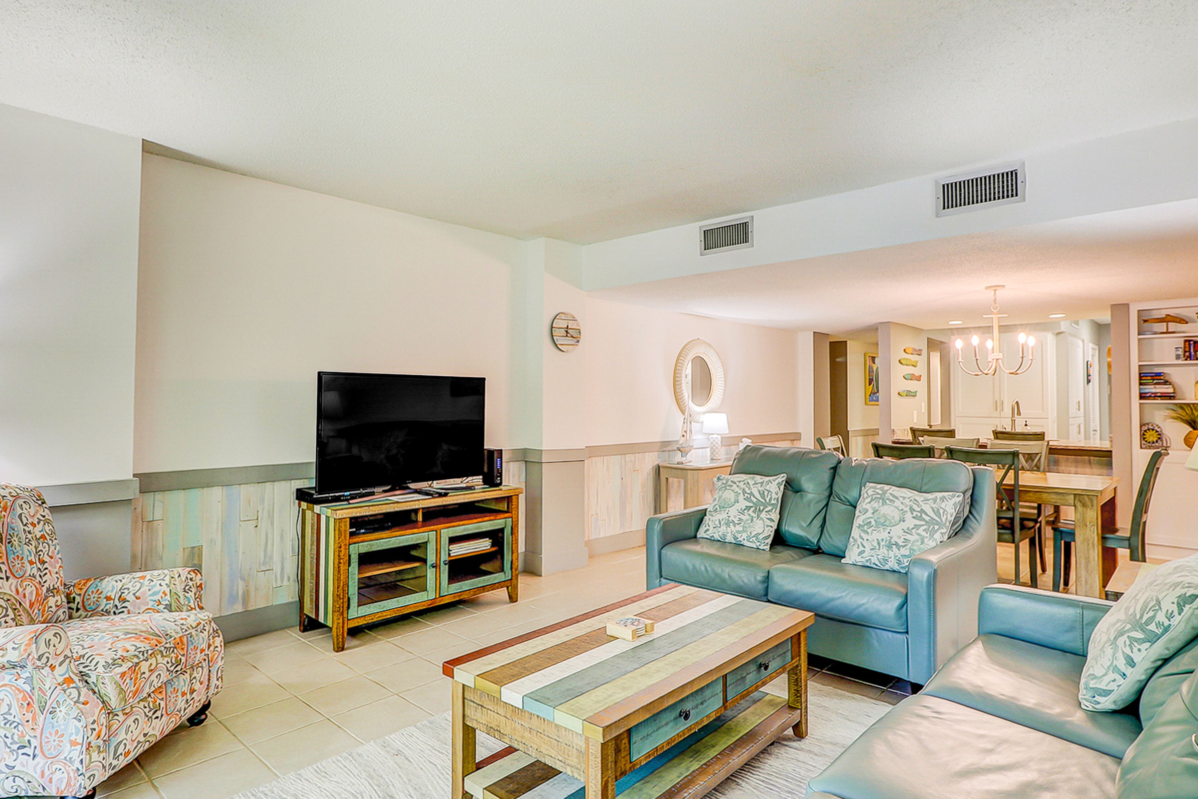 Updated beachside condo at Ocean One with 2 balconies & pool, grill, & courtyard