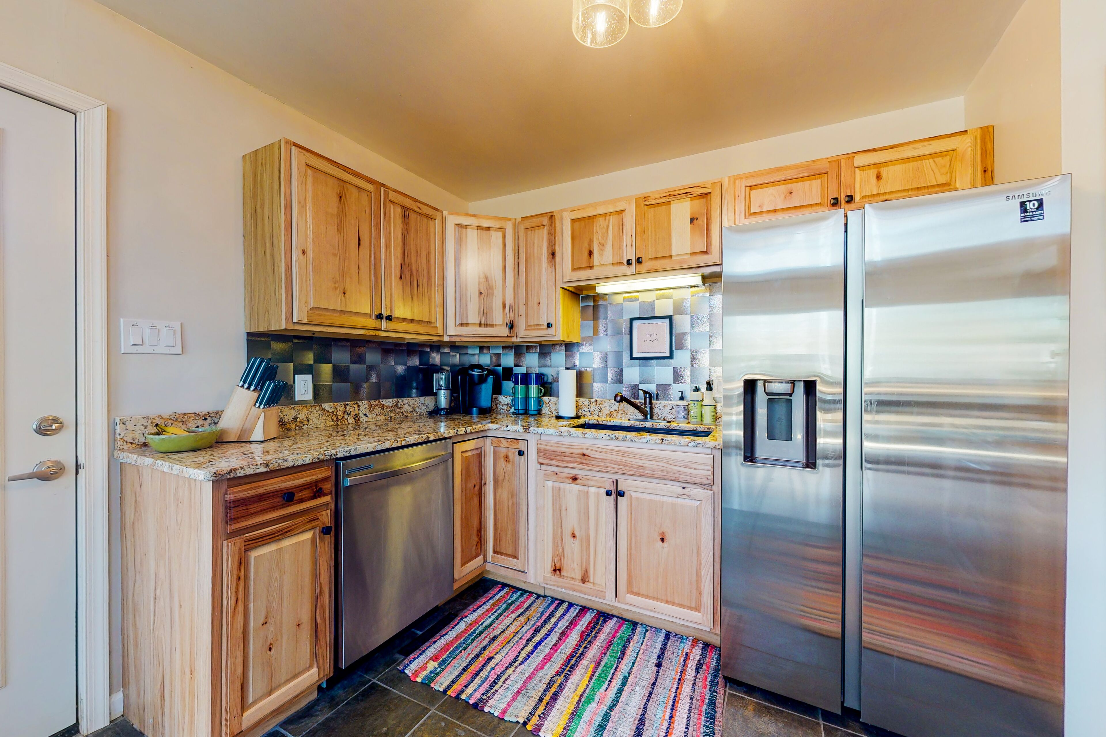 Remodeled wooded haven with firepit, yard, decks, ac, and two living areas