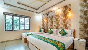 Premium Room | Desk, iron/ironing board (on request), bed sheets - Treebo Thoduvas Star Plaza Cochin Airport (Aluva)
