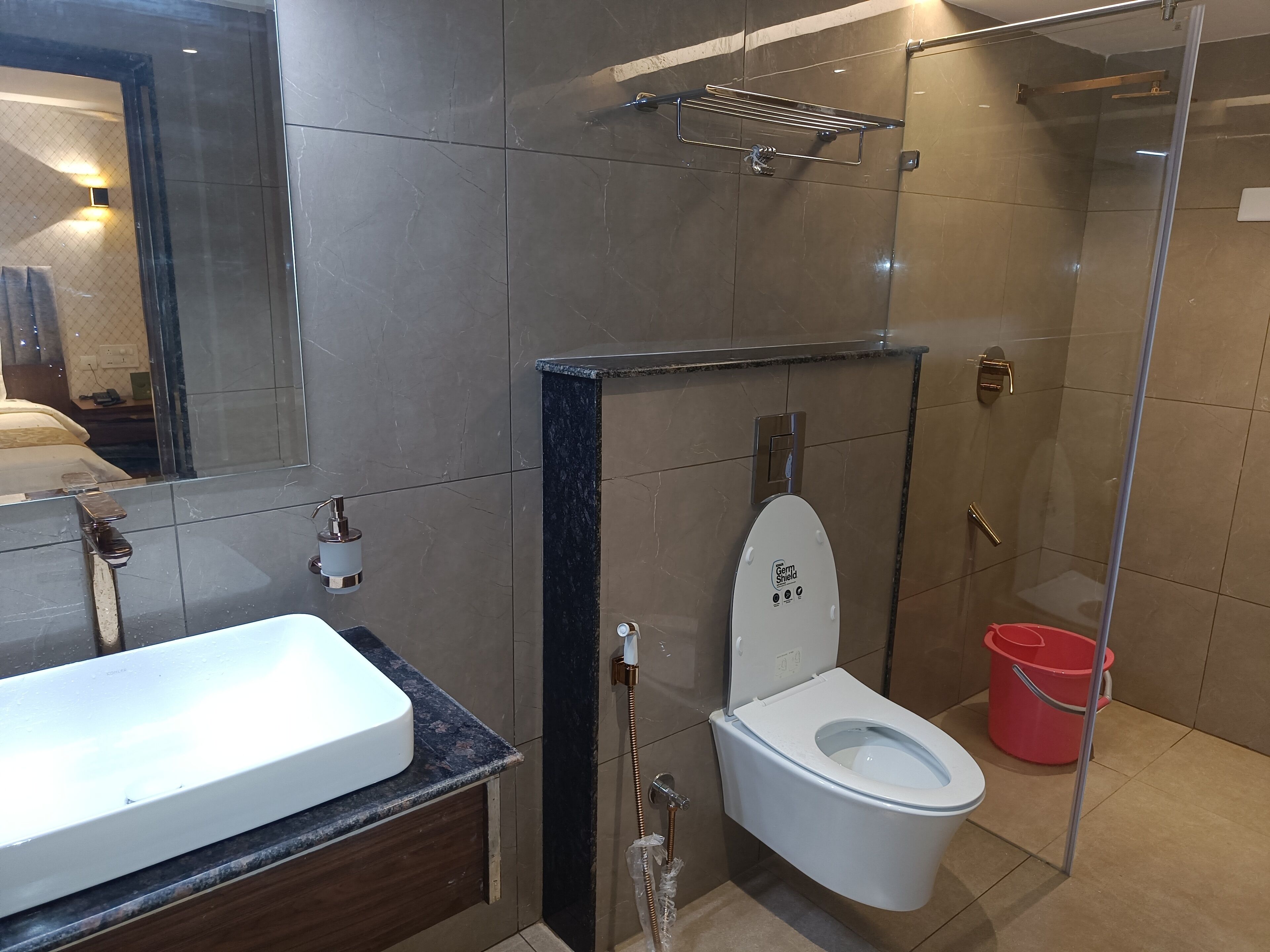 family suite | bathroom | shower, rainfall showerhead, designer toiletries, slippers