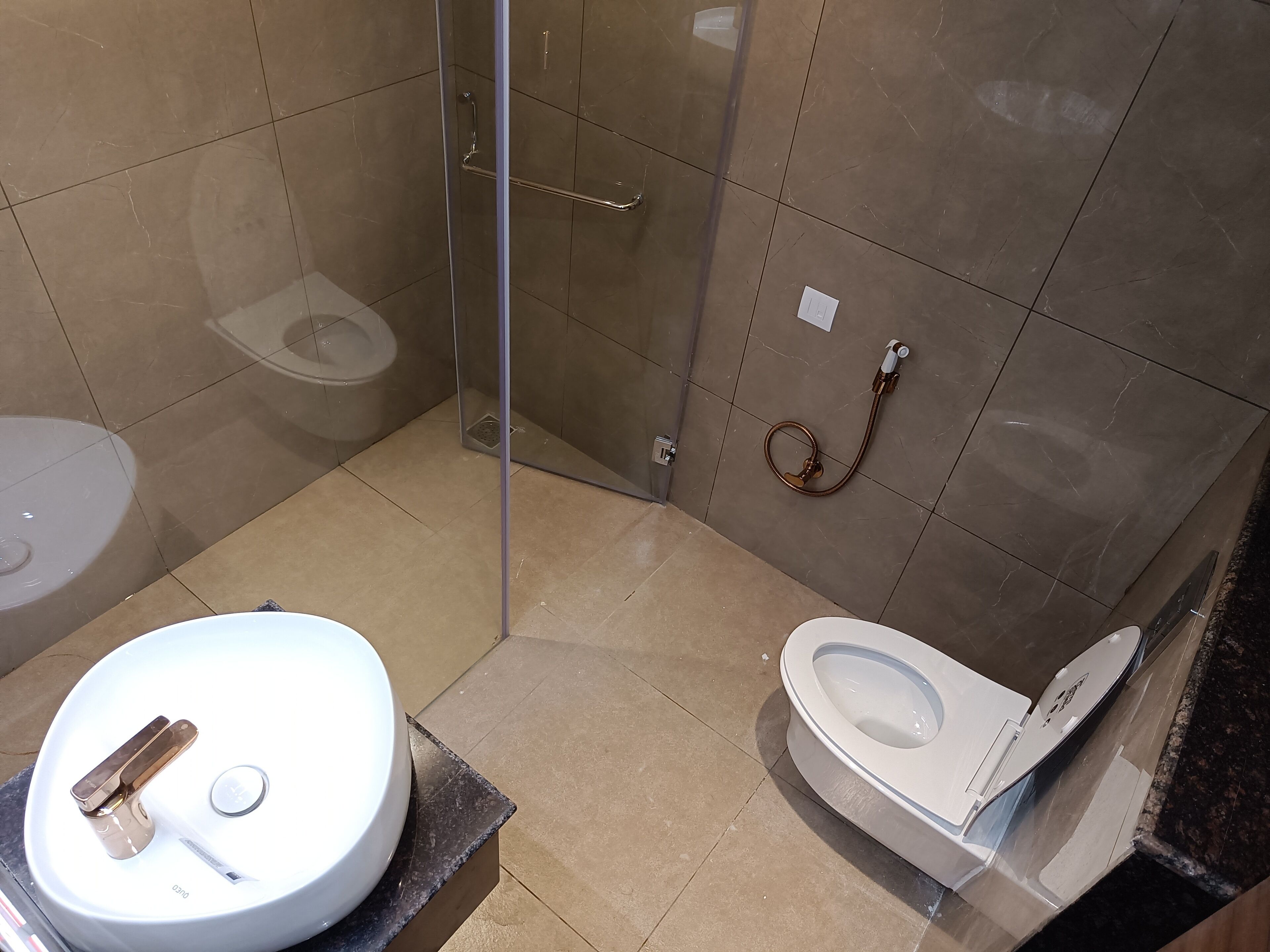 junior suite | bathroom | shower, rainfall showerhead, designer toiletries, slippers