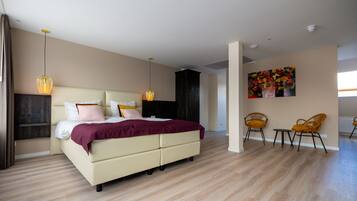 Deluxe Quadruple Room | Memory-foam beds, in-room safe, blackout curtains, iron/ironing board
