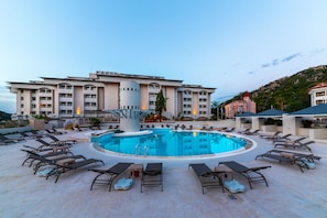 Seasonal outdoor pool, pool umbrellas, pool loungers