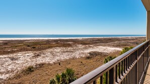 A balcony with a view of a beach and dunes. - Upscaled Gulf Front Condo, Stunning Views! - Ride The Wave (Dauphin Island)