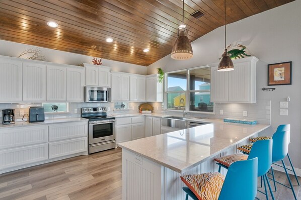 Fridge, microwave, dishwasher, coffee/tea maker - The Neon Moon - 3rd Row Coastal beauty, close to the beach w/ Gulf Views! (Crystal Beach)