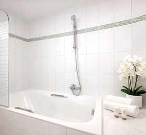 Shower, hair dryer, towels, shampoo