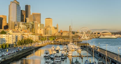 Upscale condo with reserved parking, balcony, & sleek kitchen - walk to parks