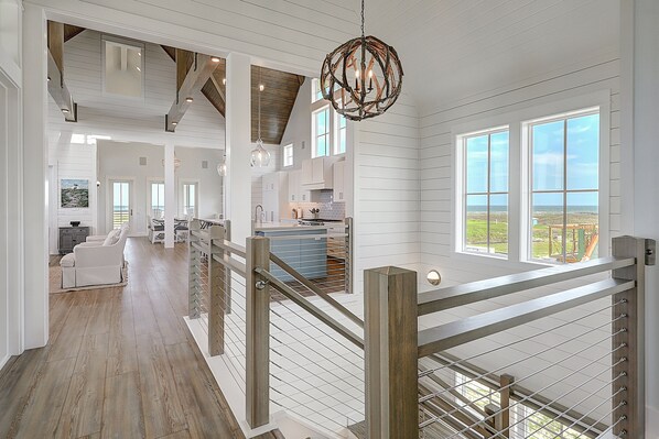 Experience the open and airy atmosphere of this spacious interior with high ceilings and large windows offering a view of the outdoors.