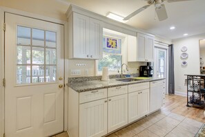 Enjoy cooking in this well-equipped kitchen with a dishwasher and coffee maker.