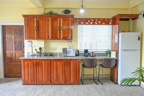 Fridge, microwave, stovetop, coffee/tea maker