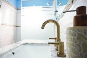 Shower, hair dryer, towels, toilet paper