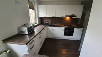 Microwave, oven, coffee/tea maker, cookware/dishes/utensils