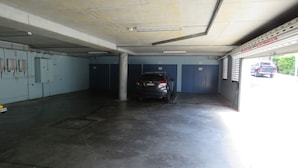 A parking garage with a car parked in the center. - Avenues Unit 1 (South West Rocks)