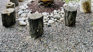 A backyard with a wooden deck, a fire pit, and a small shed. - Music Lover’s Getaway - Red Rocks + Denver (Wheat Ridge)