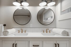 Combined shower/tub, hair dryer, towels, soap