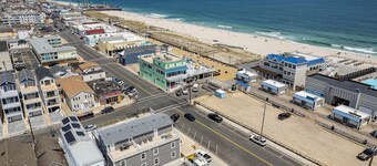 Spacious 4BR Coastal Condo • Steps to Beach & Boardwalk • Parking + Badges