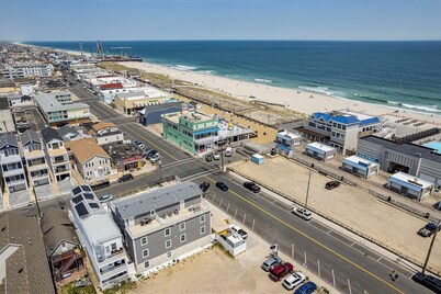 Spacious 4BR Coastal Condo • Steps to Beach & Boardwalk • Parking + Badges