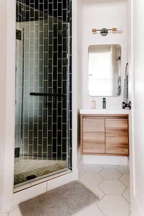 Shower, eco-friendly toiletries, hair dryer, towels