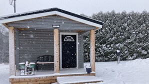 A wooden cabin with a porch, a bench, and a mailbox. - Tiny Cabin, pet-friendly Mins from Cook Forest & Allegheny National Forest! (Marienville)