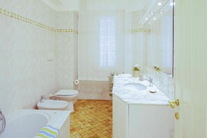 Bathtub, hair dryer, bidet