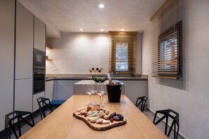Enjoy cooking in this well-equipped kitchen with a central island, oven, and microwave.