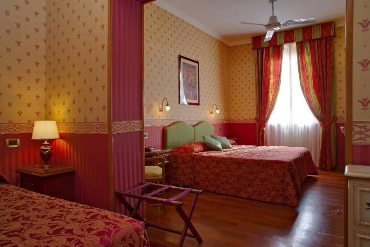 Standard Triple Room | Minibar, in-room safe, iron/ironing board (on request), WiFi (free)