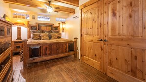 A wooden bedroom with a large bed, a wardrobe, and a ceiling fan. - Perfect view of Super Bee, ski-in/out, wonderful sunlight, free WiFi, parking (Copper Mountain)