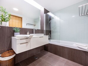 Bathtub, hair dryer, towels