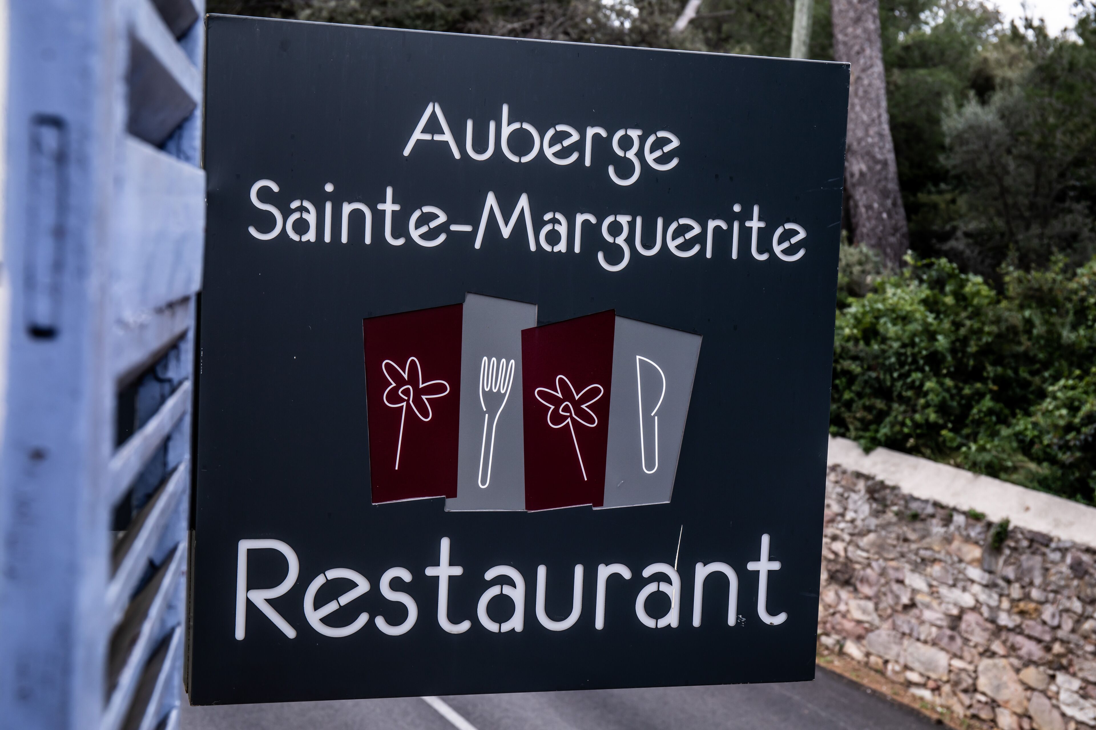 A sign for Auberge Sainte-Marguerite Restaurant.