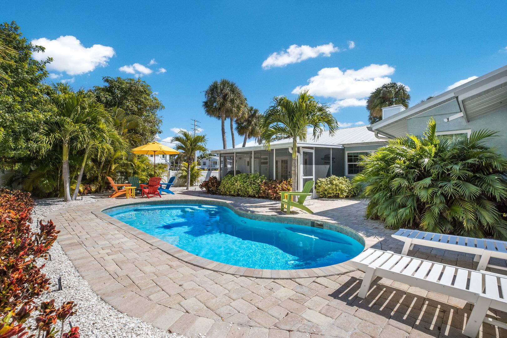A heated pool, sun loungers