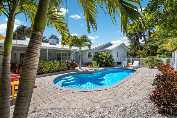 A heated pool, pool loungers