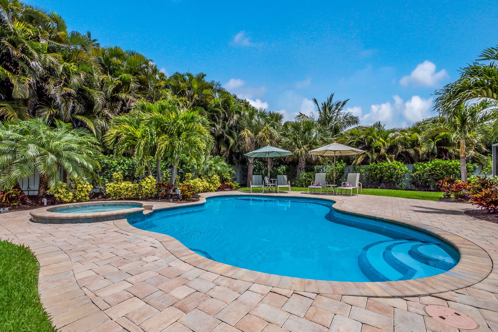 A heated pool, sun loungers
