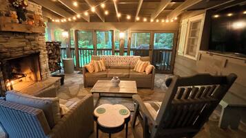 Smart TV, fireplace, books, computer monitors