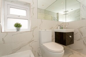 Combined shower/tub, jetted tub