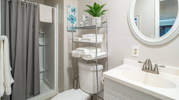 Combined shower/bathtub, hair dryer, towels, soap