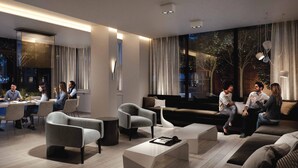 A modern interior with a dining area, seating, and a large window with a view.