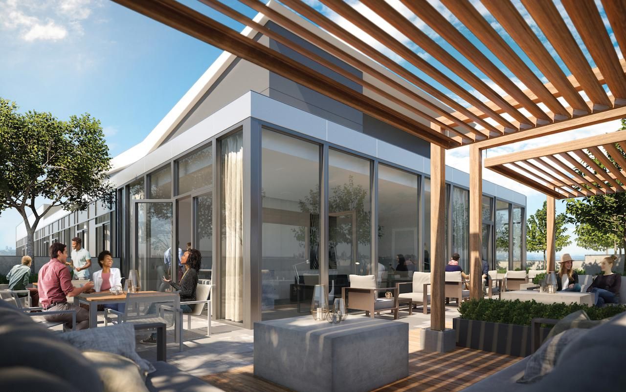 An outdoor seating area with modern furniture and a wooden pergola.