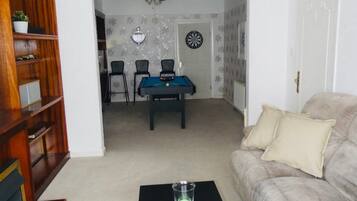 Flat-screen TV, video-game console, books