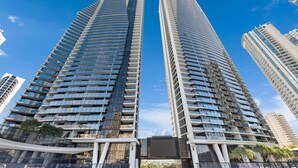 Two tall, modern skyscrapers with reflective glass facades and balconies. - Circle on Cavill Ocean View  Surfers Paradise (Surfers Paradise)