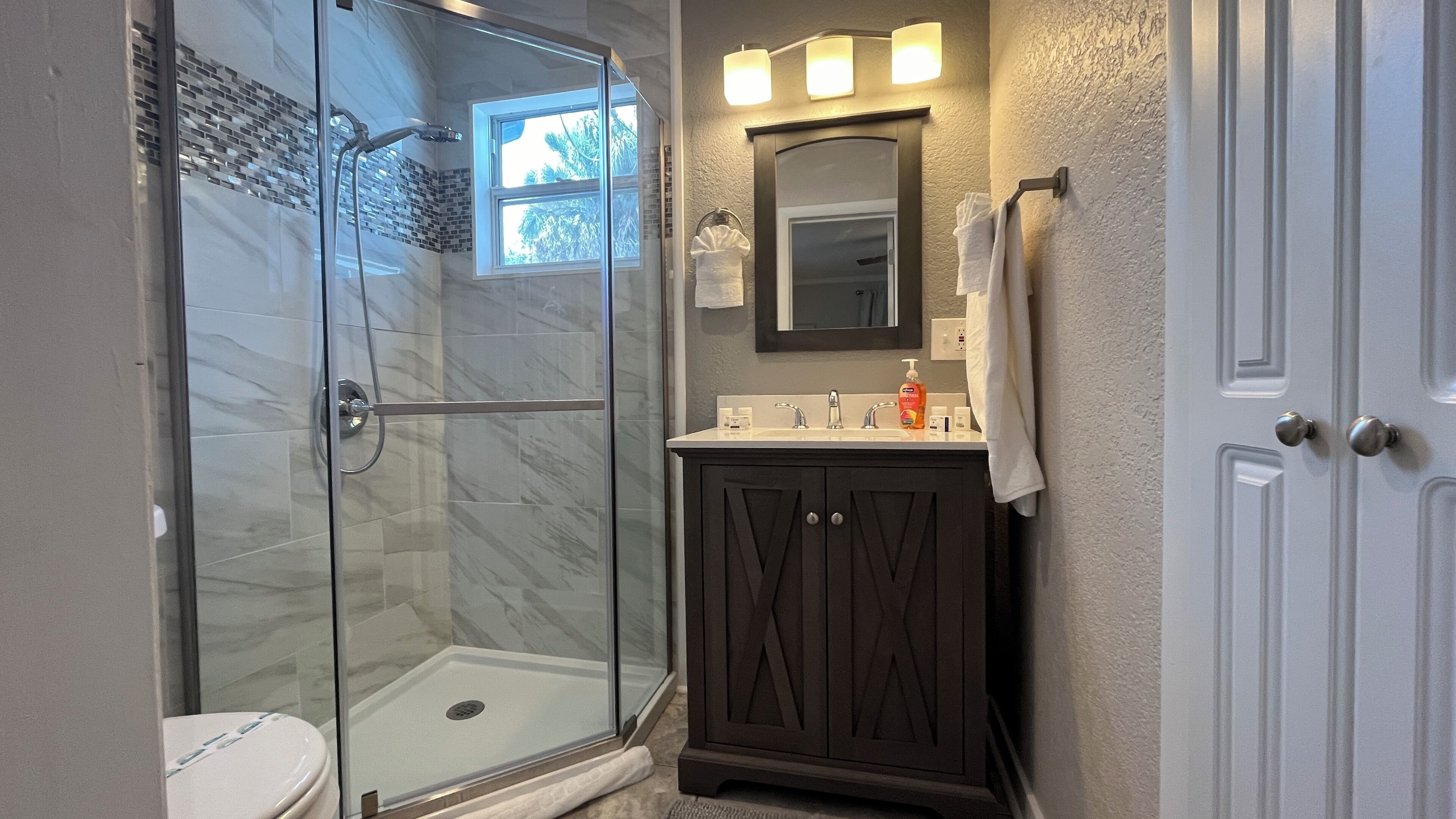Shower, eco-friendly toiletries, hair dryer, towels