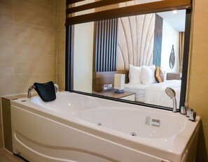 Luxury Double Room, 1 King Bed, City View | Bathroom | Shower, hydromassage showerhead, hair dryer, bathrobes