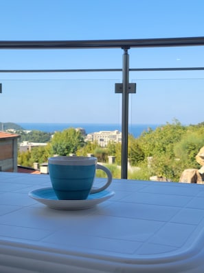 Enjoy a peaceful retreat with a balcony overlooking a serene residential area.
