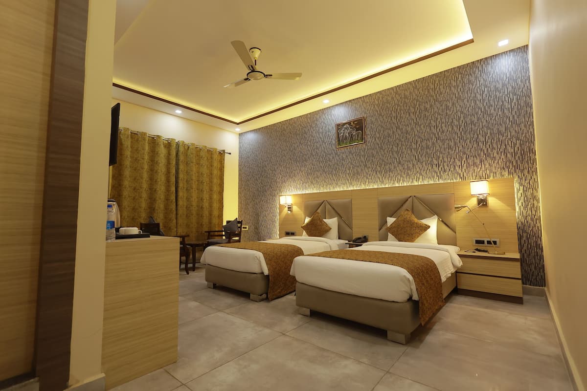 Premium bedding, desk, laptop workspace, blackout drapes