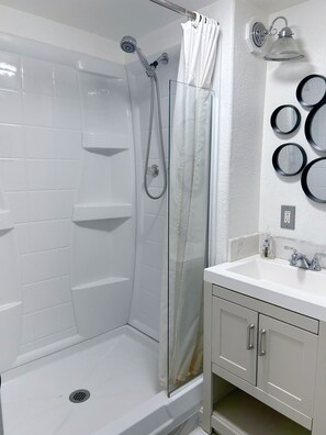 Combined shower/tub, hair dryer, towels, soap