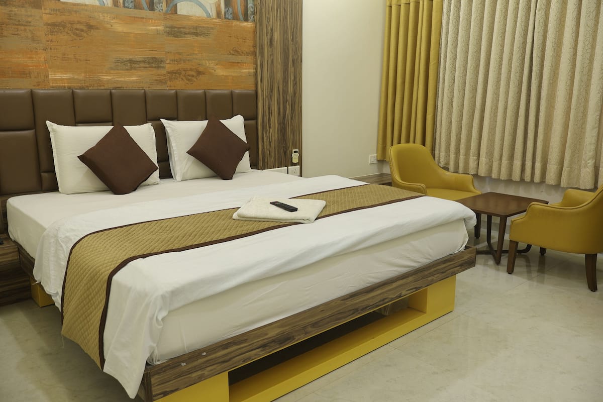 Habitación ejecutiva | Ropa de cama de alta calidad y escritorio