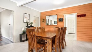Enjoy meals in this cozy dining area with a wooden table and six chairs.