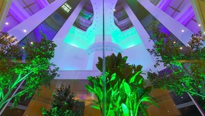A modern atrium with a glass ceiling, allowing natural light to illuminate the space. - Grand Hotel Sveti Vlas (Sveti Vlas)